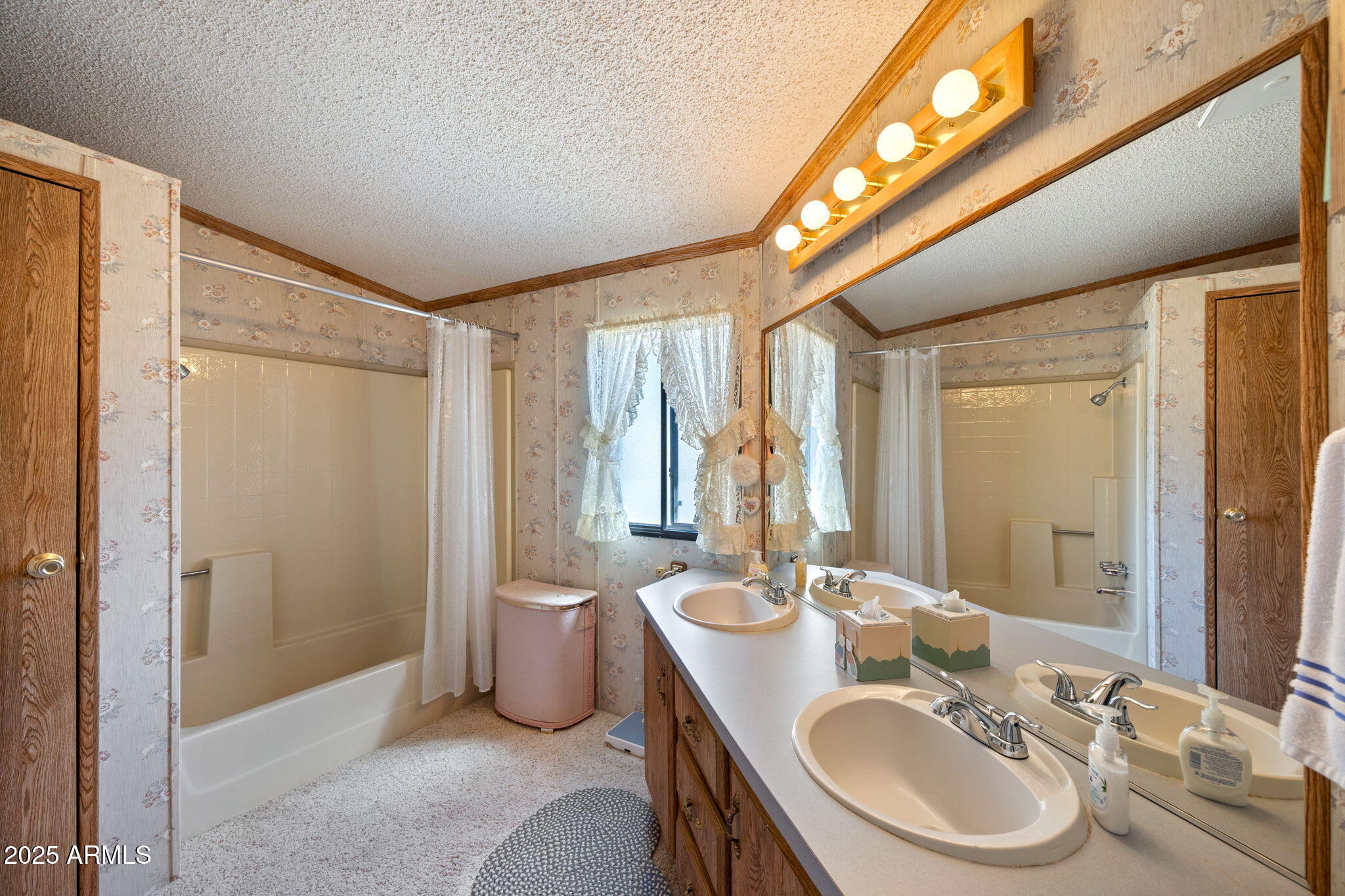 2841 Pine Rim Road Overgaard, AZ 85933 - Photo 18 of 36 a bathroom with a sink and a mirror