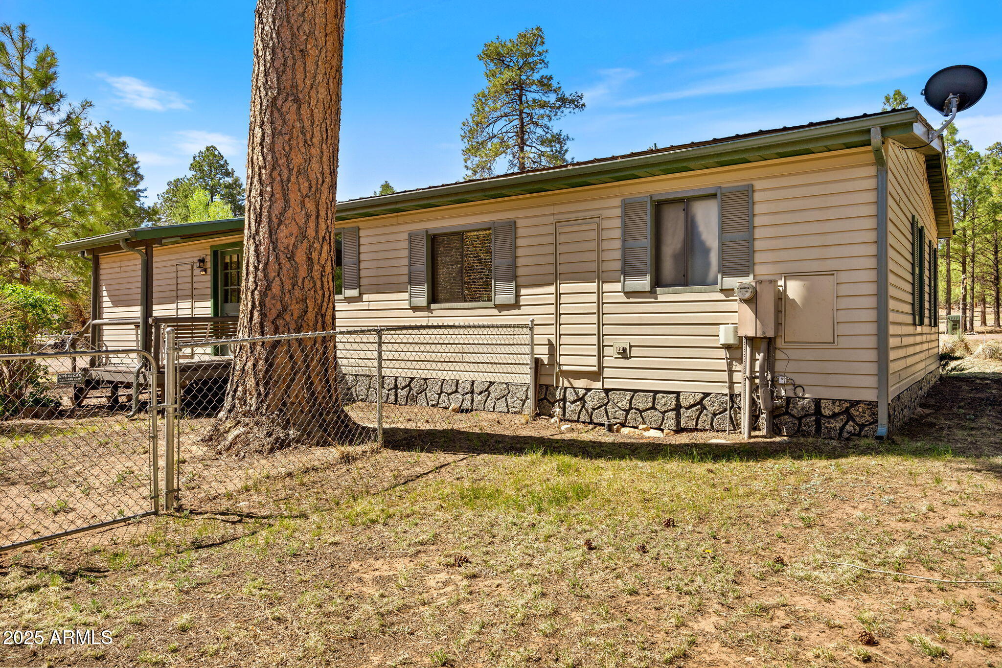 2841 Pine Rim Road Overgaard, AZ 85933 - Photo 25 of 36 a front view of a house with a yard