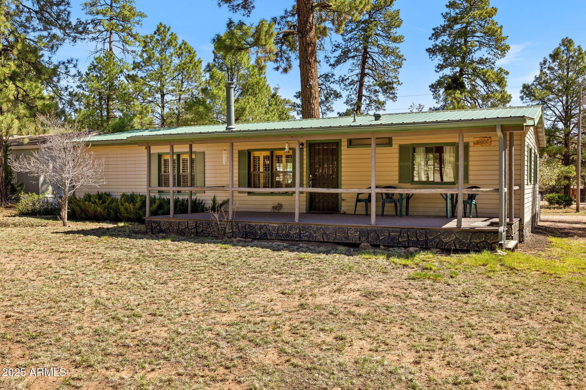2841 Pine Rim Road Overgaard, AZ 85933 - Photo 3 of 36 a view of a house with a patio