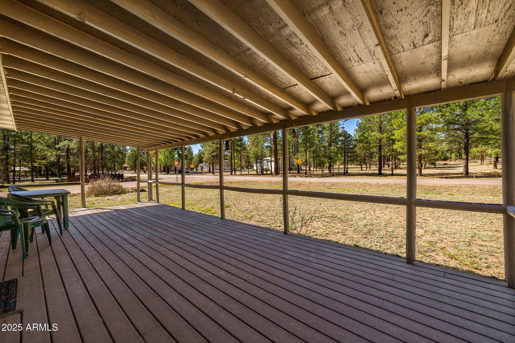 2841 Pine Rim Road Overgaard, AZ 85933 - Photo 5 of 36 a view of a patio with wooden floor