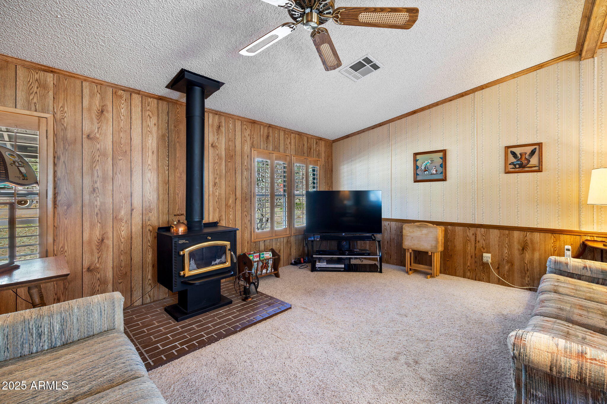 2841 Pine Rim Road Overgaard, AZ 85933 - Photo 8 of 36 a living room with furniture and a flat screen tv