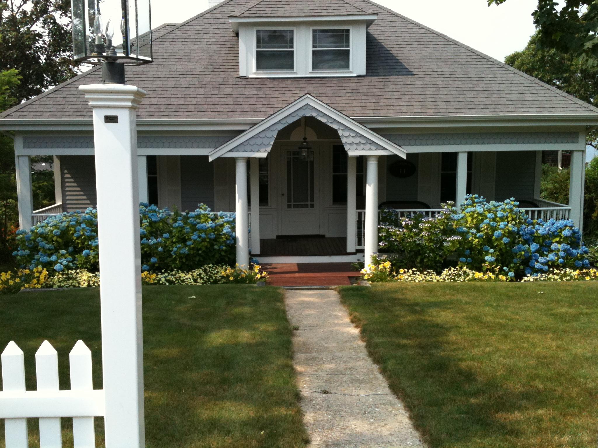 11 Hawes Road Sagamore Beach, MA 02562 - Photo 1 of 4 a view of a house with garden