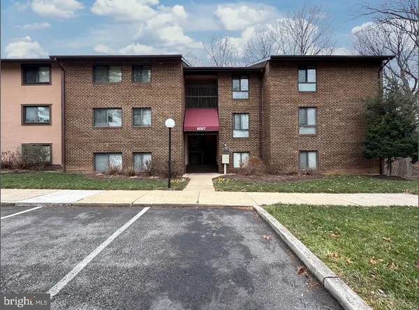 a brick building with a yard
