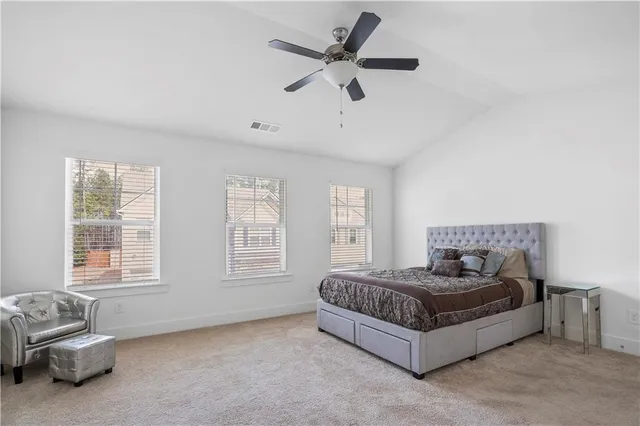 a living room with a bed furniture and a window