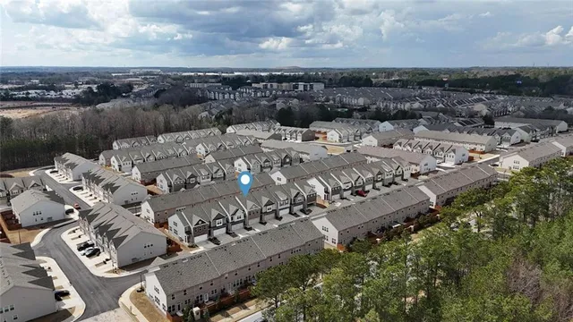 an aerial view of a house with outdoor space