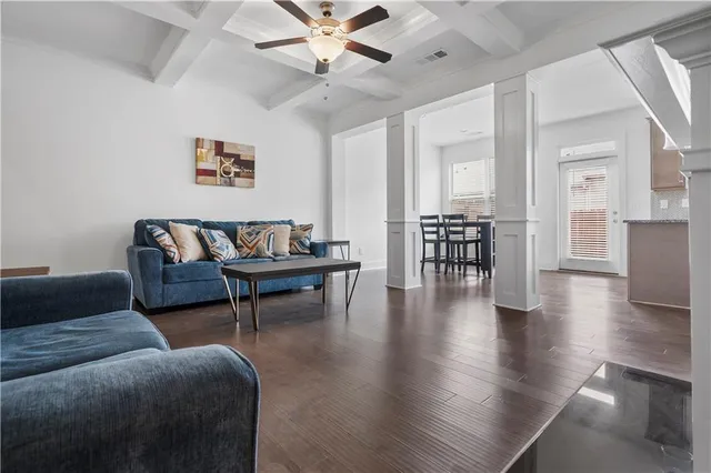 a living room with furniture and a table