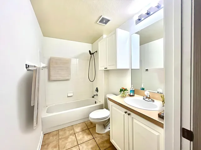 a bathroom with a sink a toilet and a bathtub