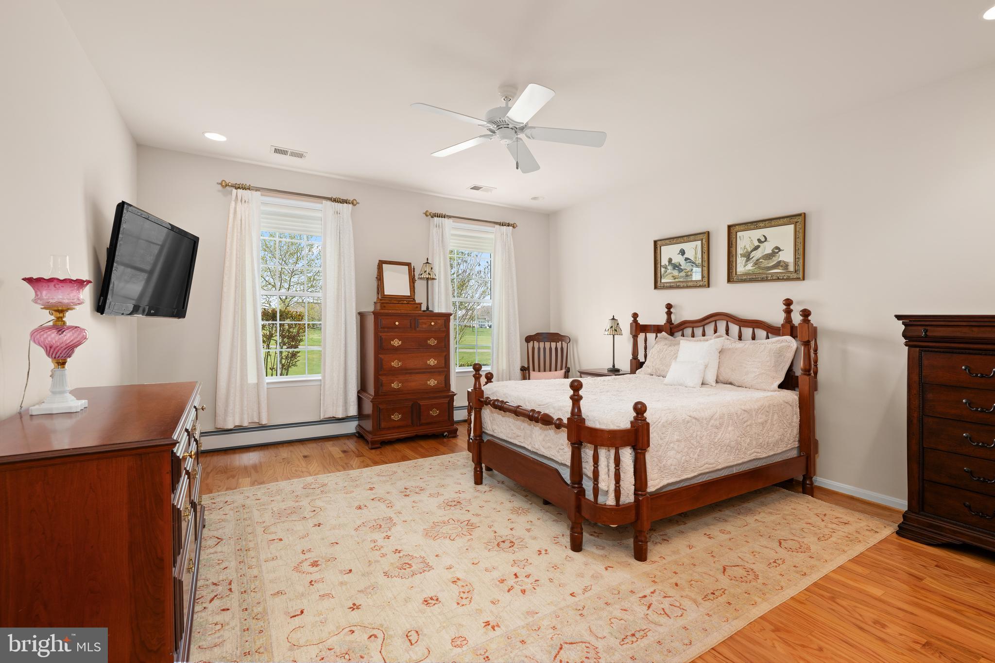 152 Widgeon Way Bridgeville, DE 19933 - Photo 14 of 37 a spacious bedroom with a bed and a flat screen tv