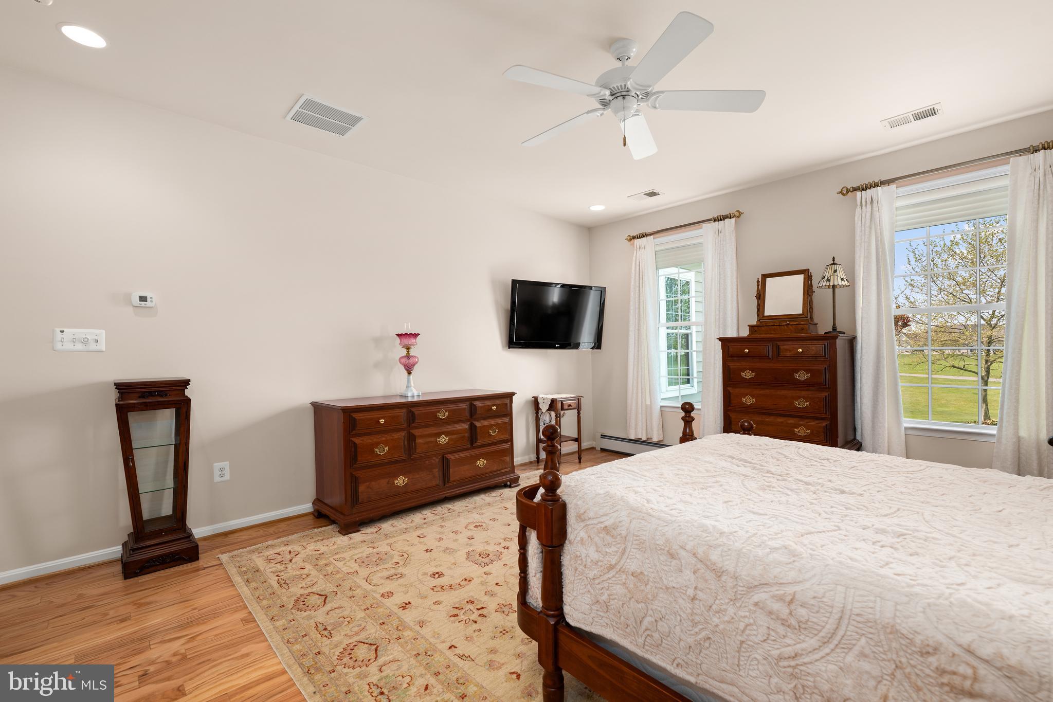 152 Widgeon Way Bridgeville, DE 19933 - Photo 15 of 37 a bedroom with a bed and a flat screen tv