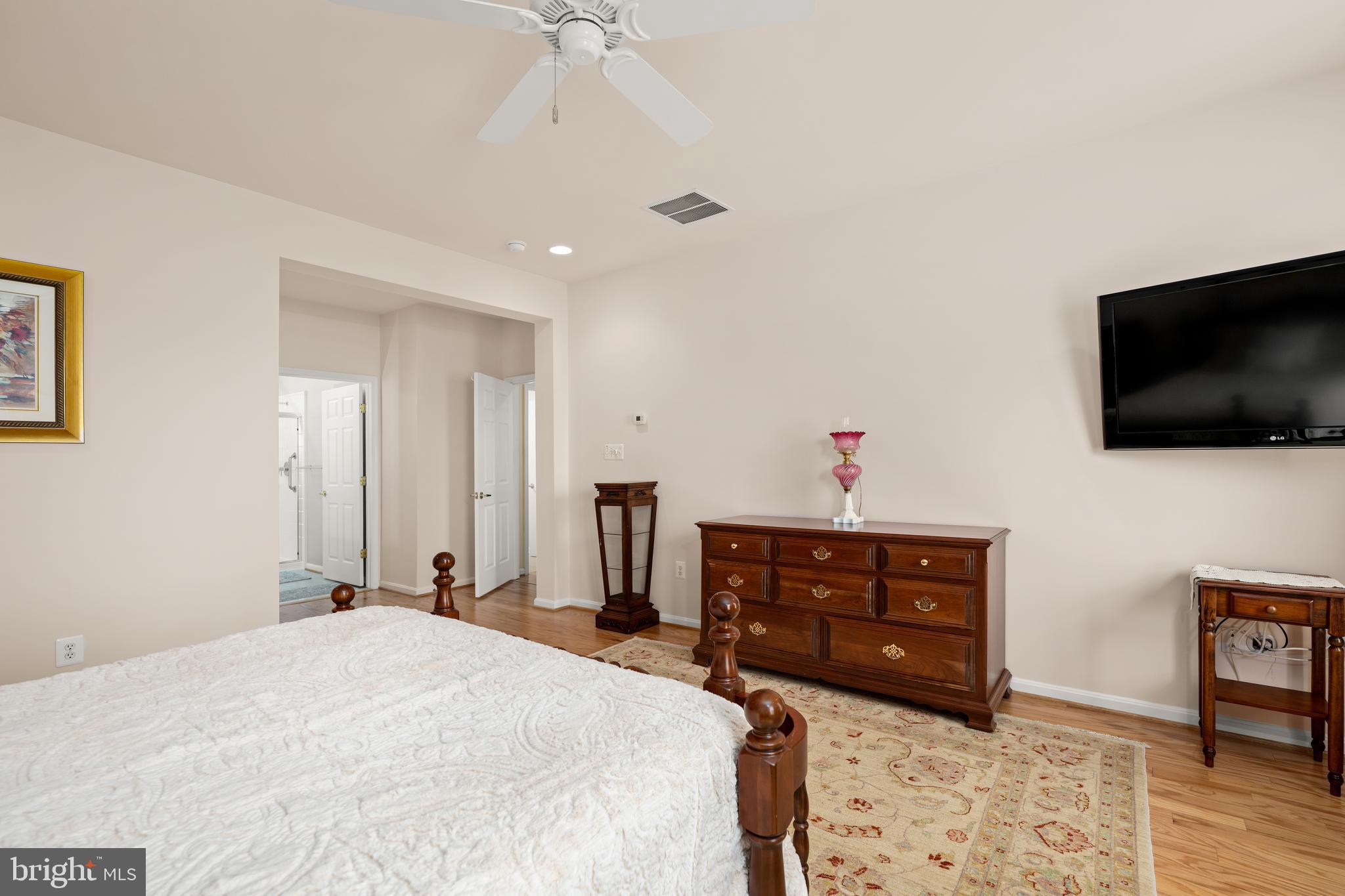 152 Widgeon Way Bridgeville, DE 19933 - Photo 16 of 37 a bedroom with a bed and a flat screen tv