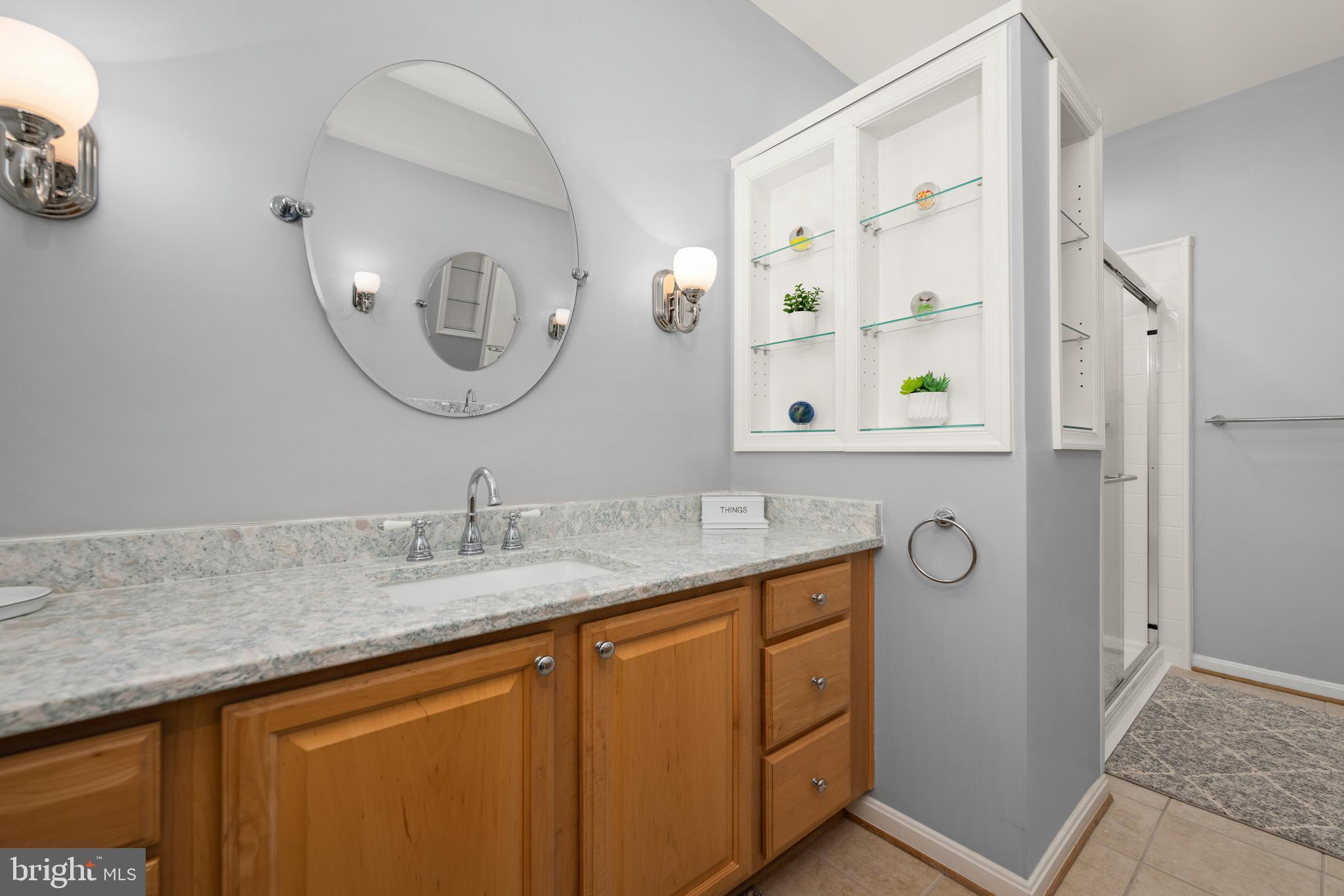 152 Widgeon Way Bridgeville, DE 19933 - Photo 20 of 37 a bathroom with a granite countertop sink mirror and vanity
