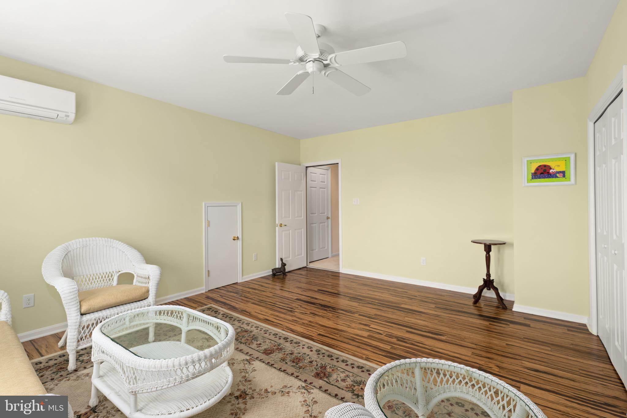 152 Widgeon Way Bridgeville, DE 19933 - Photo 30 of 37 a bedroom with a bed and a chandelier
