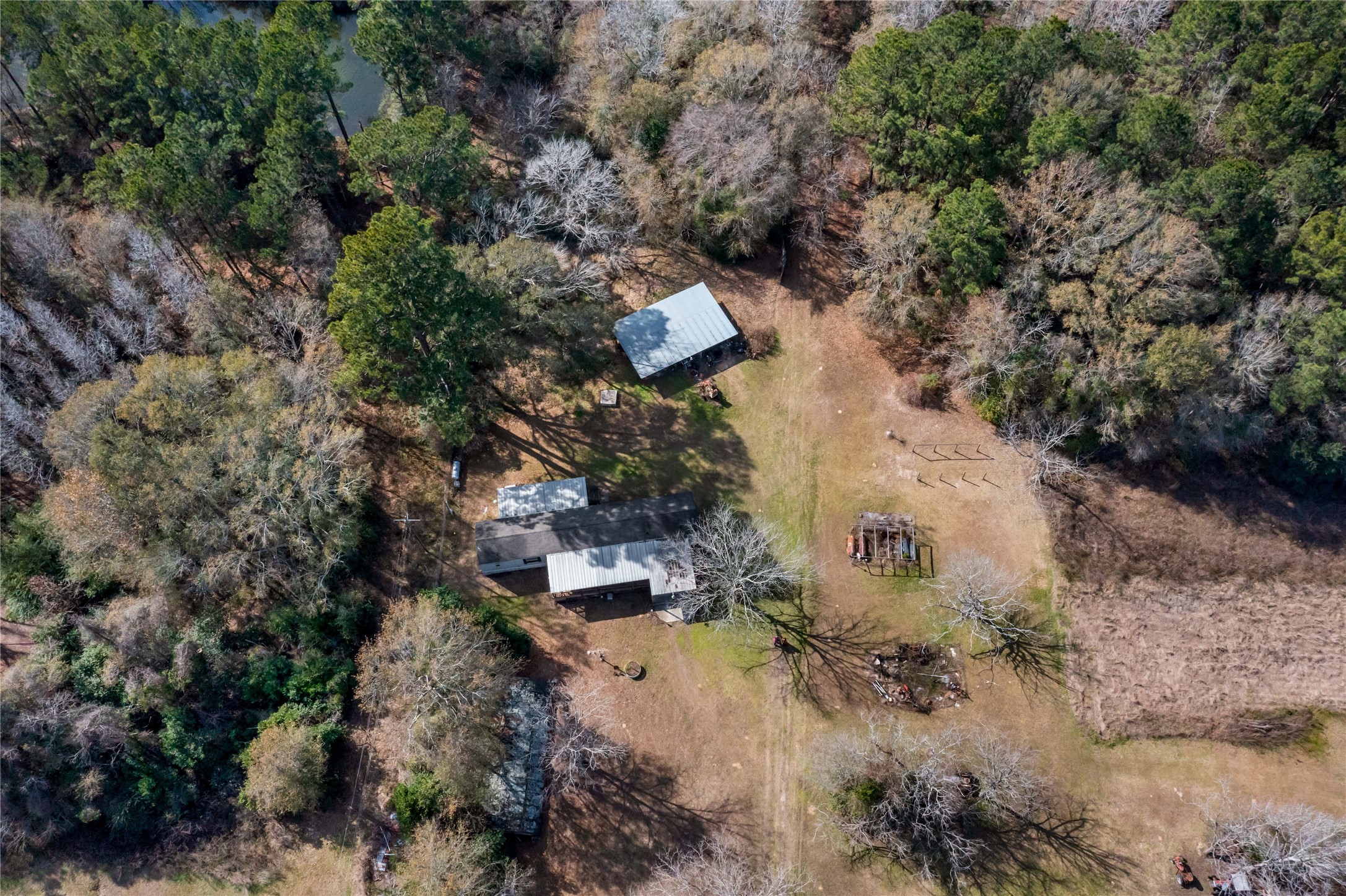 10388 Rutherford Circle Cleveland, TX 77328 - Photo 4 of 14 Overhead view tying together the home site, land, and surrounding setting.