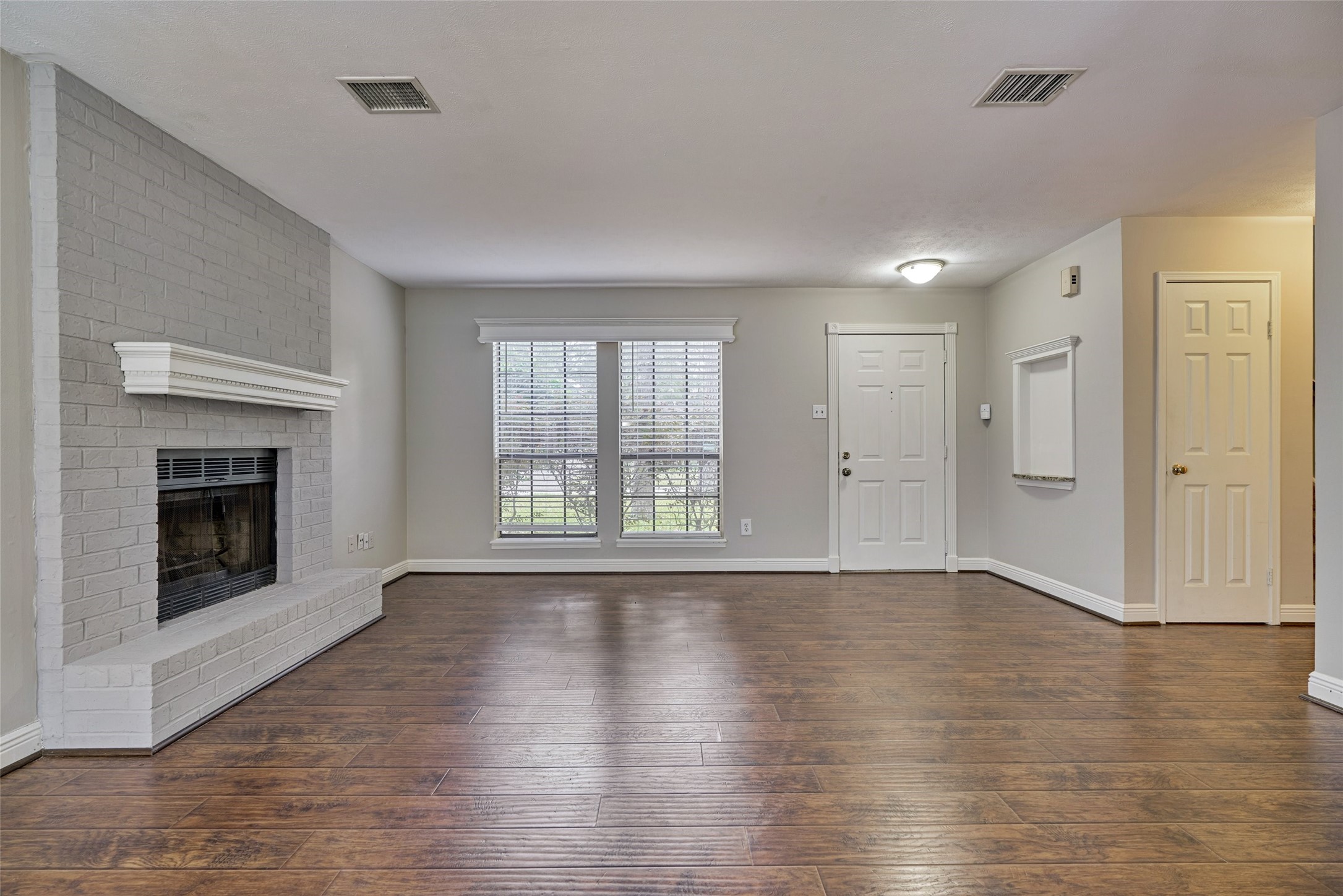 3 Field Flower Court Spring, TX 77380 - Photo 11 of 36 wooden floor fireplace and windows in an empty room