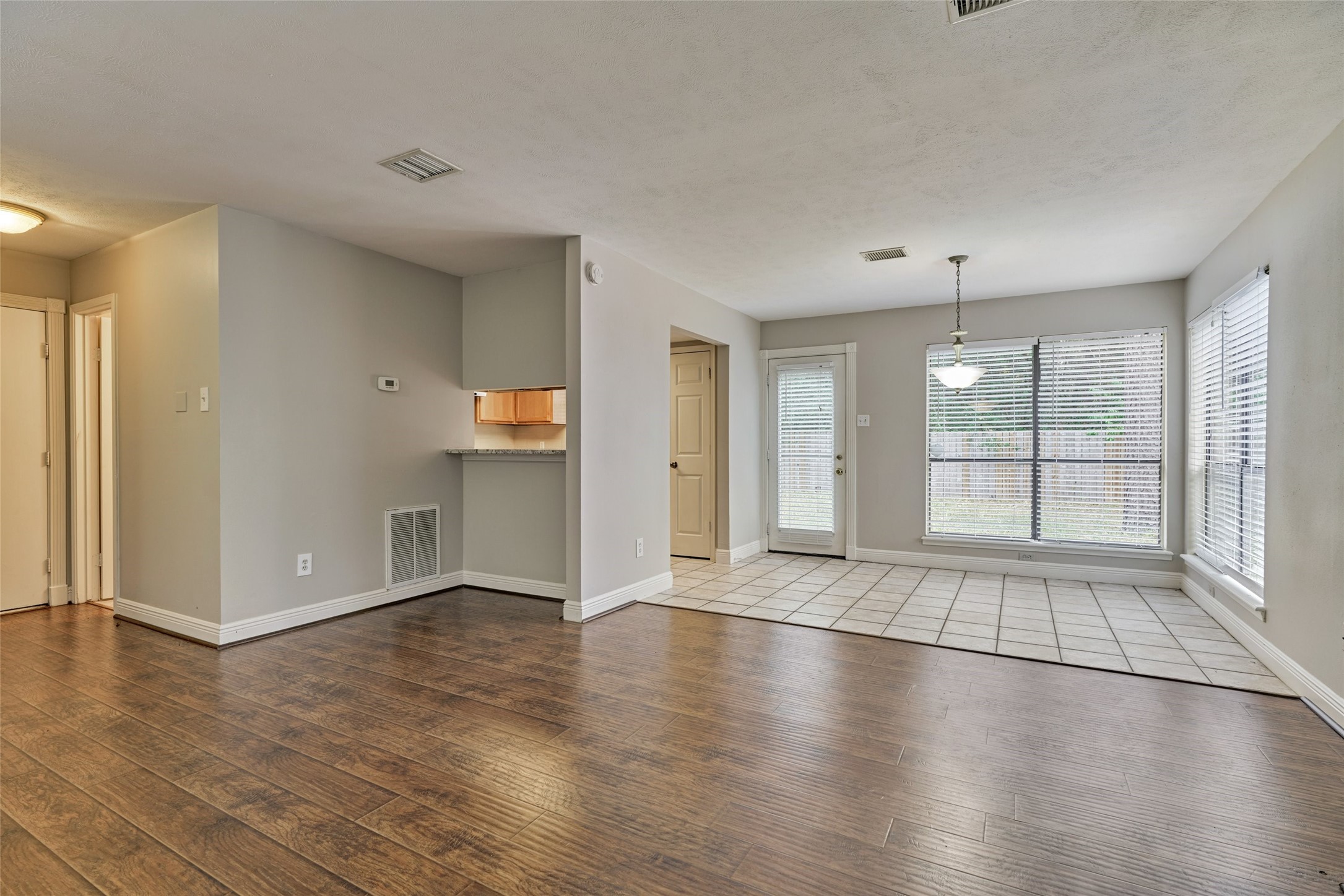 3 Field Flower Court Spring, TX 77380 - Photo 12 of 36 a view of an empty room with wooden floor and a window