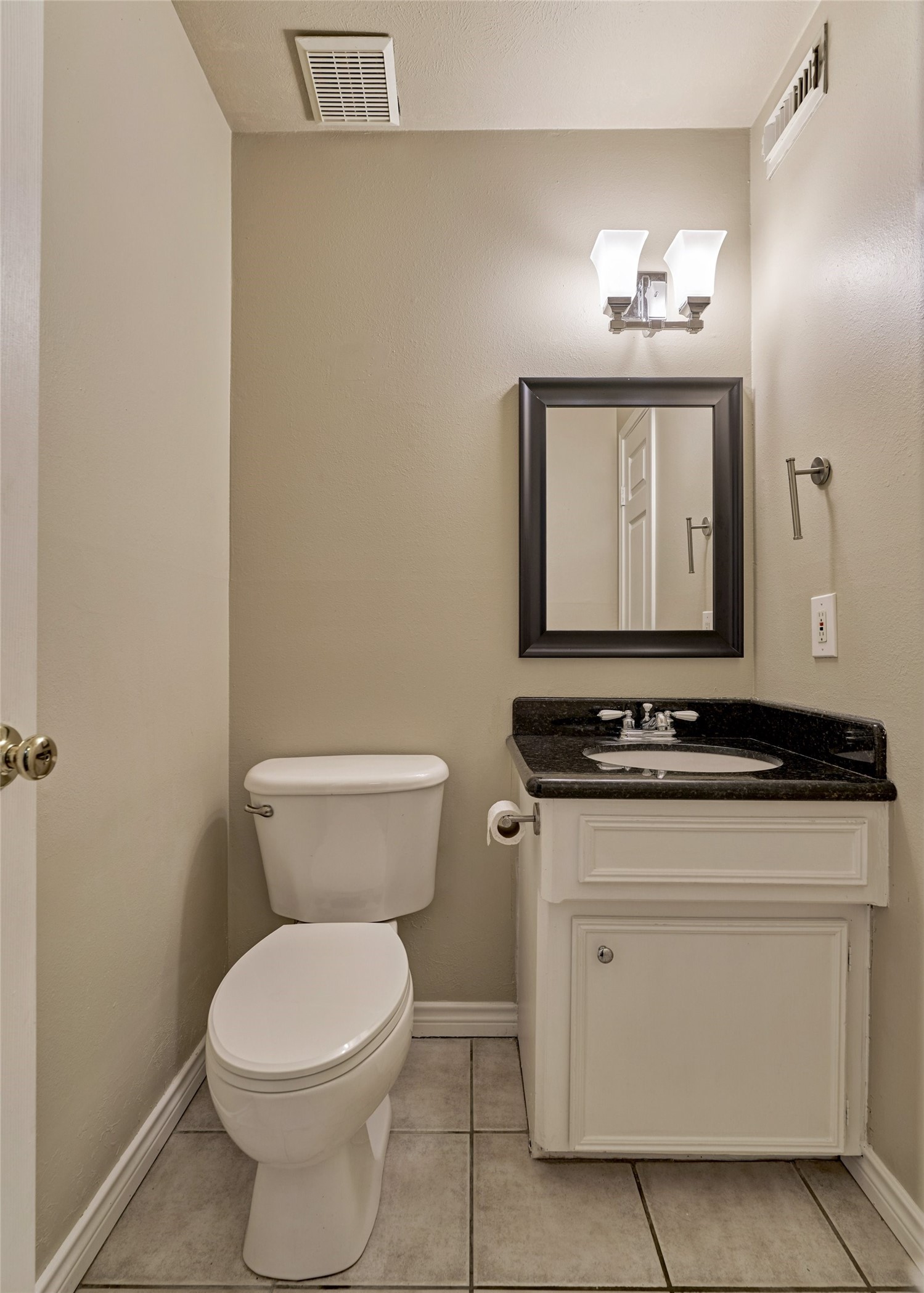 3 Field Flower Court Spring, TX 77380 - Photo 17 of 36 a bathroom with a toilet sink and mirror