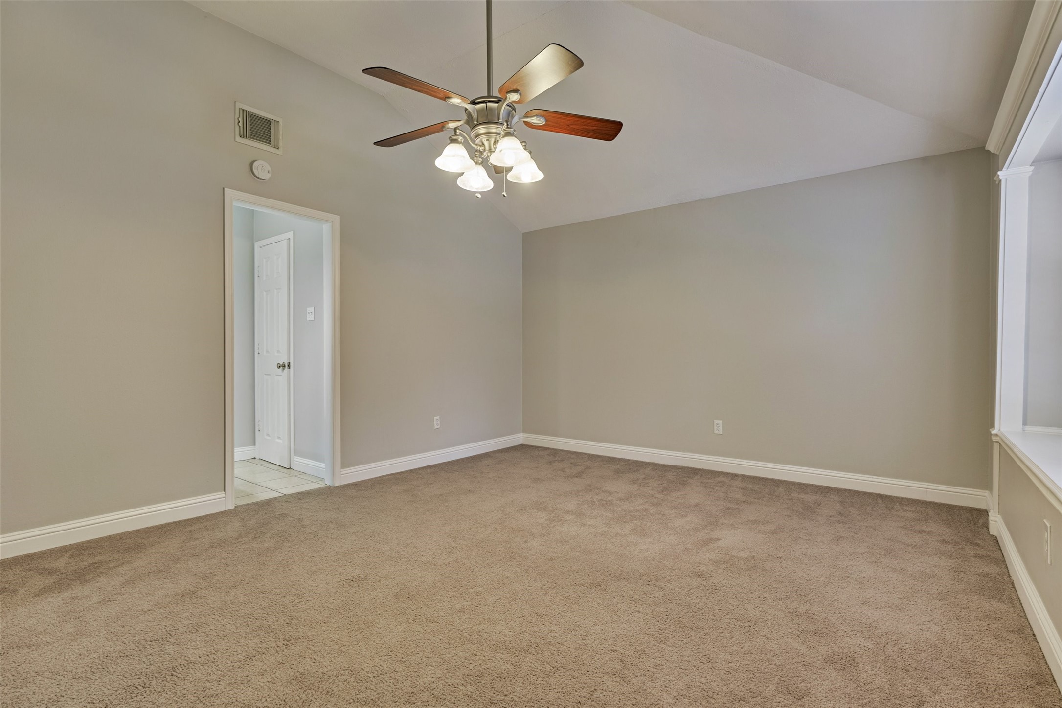 3 Field Flower Court Spring, TX 77380 - Photo 20 of 36 an empty room with a chandelier fan
