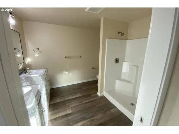 a bathroom with a shower and toilet