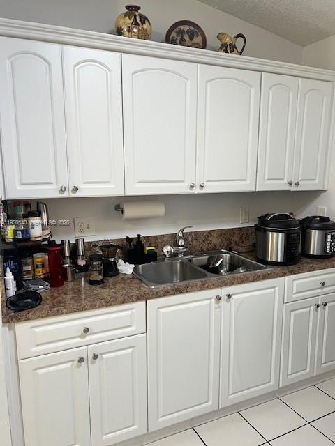 2815 West 76th Street, Unit 20217 Hialeah, FL 33018 - Photo 4 of 10 a kitchen with white cabinets and white appliances