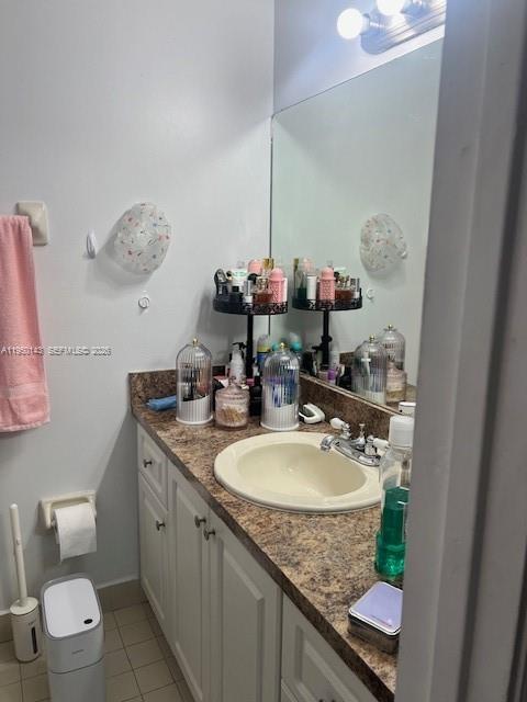 2815 West 76th Street, Unit 20217 Hialeah, FL 33018 - Photo 7 of 10 a bathroom with a granite countertop sink a mirror and a toilet