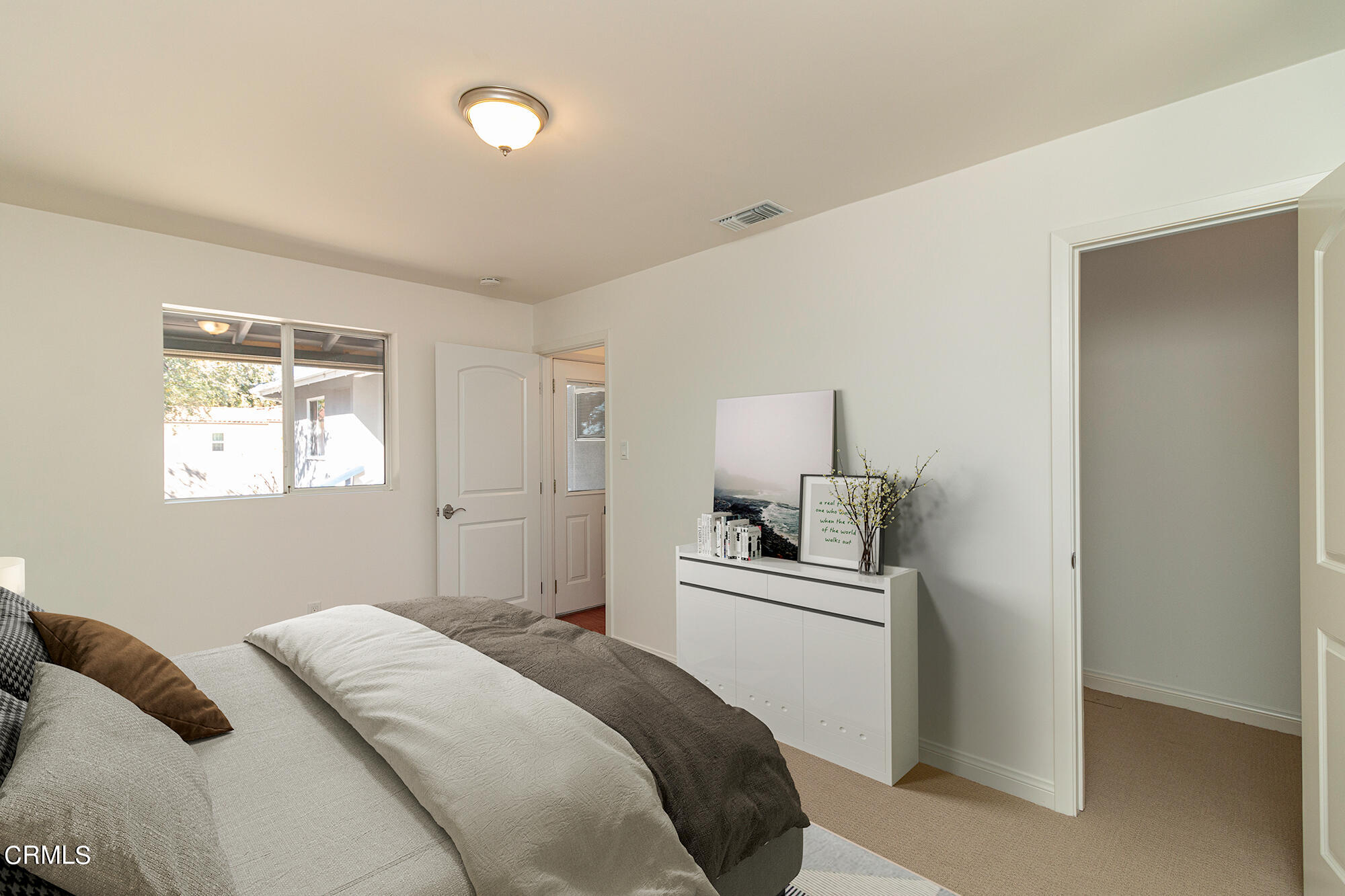 3850 Shadow Grove Road Pasadena, CA 91107 - Photo 11 of 16 a bedroom with a bed and cabinets