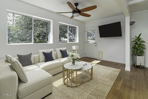 3850 Shadow Grove Road Pasadena, CA 91107 - Photo 8 of 16 a living room with furniture a flat screen tv and a large window