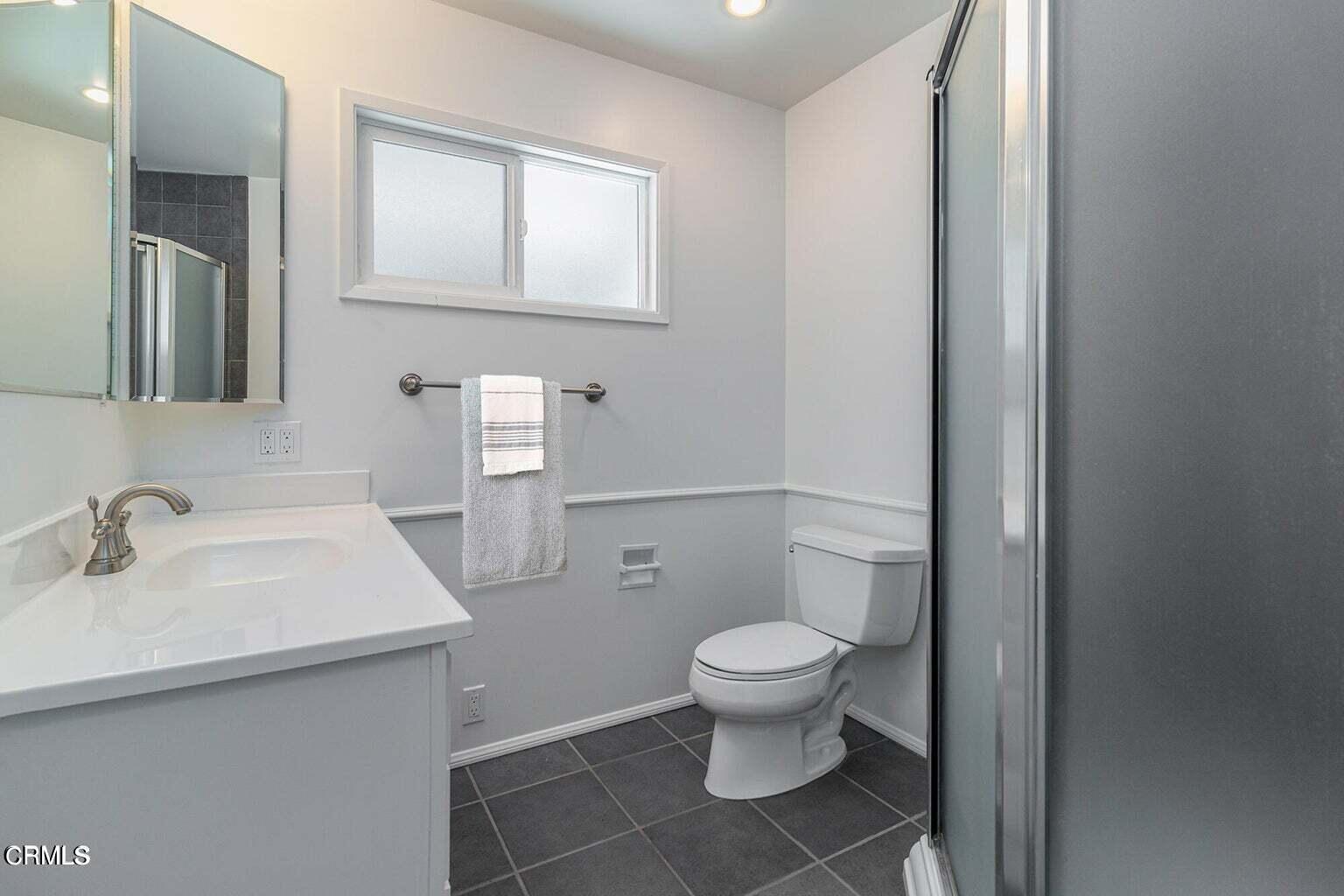 3850 Shadow Grove Road Pasadena, CA 91107 - Photo 10 of 16 a bathroom with a sink toilet and mirror