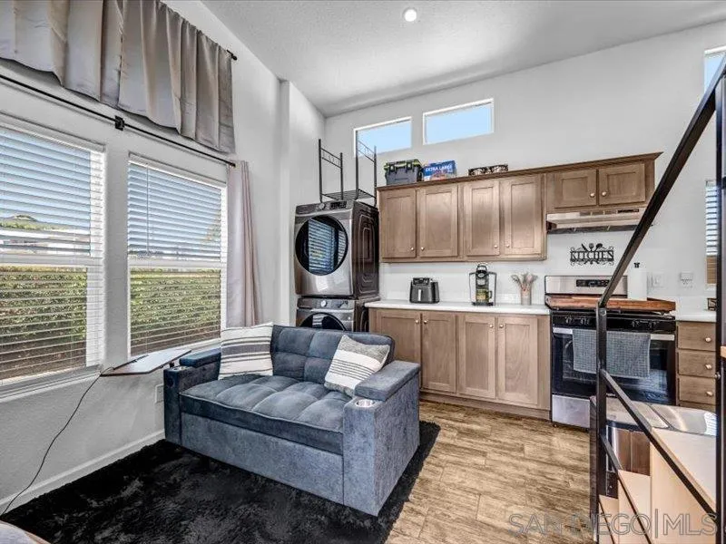 14291 Rios Canyon Road, Unit 3 El Cajon, CA 92021 - Photo 7 of 16 a living room with furniture and a window