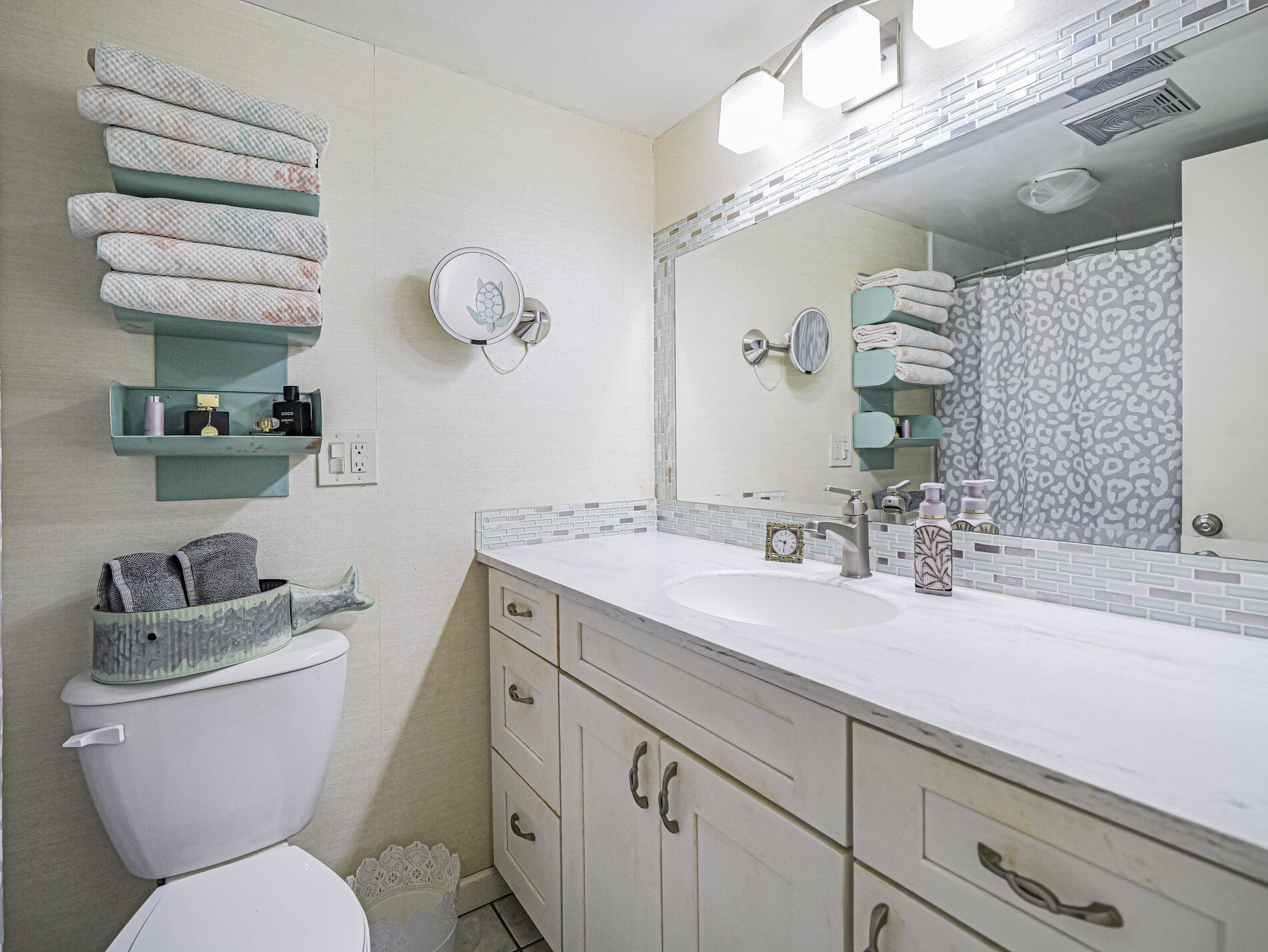 1987 Southwest Palm City Road, Unit BLDG 45 D Stuart, FL 34994 - Photo 16 of 49 a bathroom with a toilet a sink and mirror