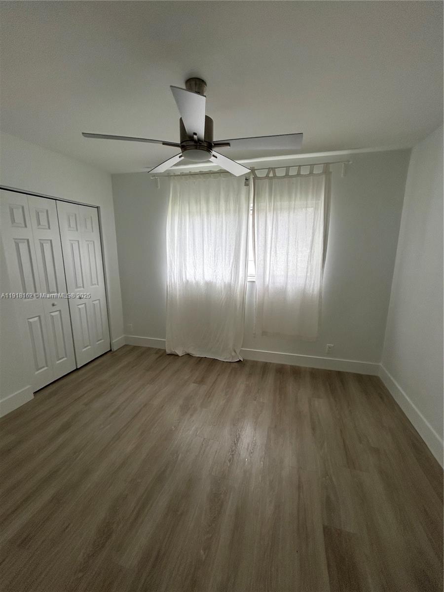 6121 Southwest 48th Court, Unit 3 Davie, FL 33314 - Photo 11 of 14 a view of an empty room and window