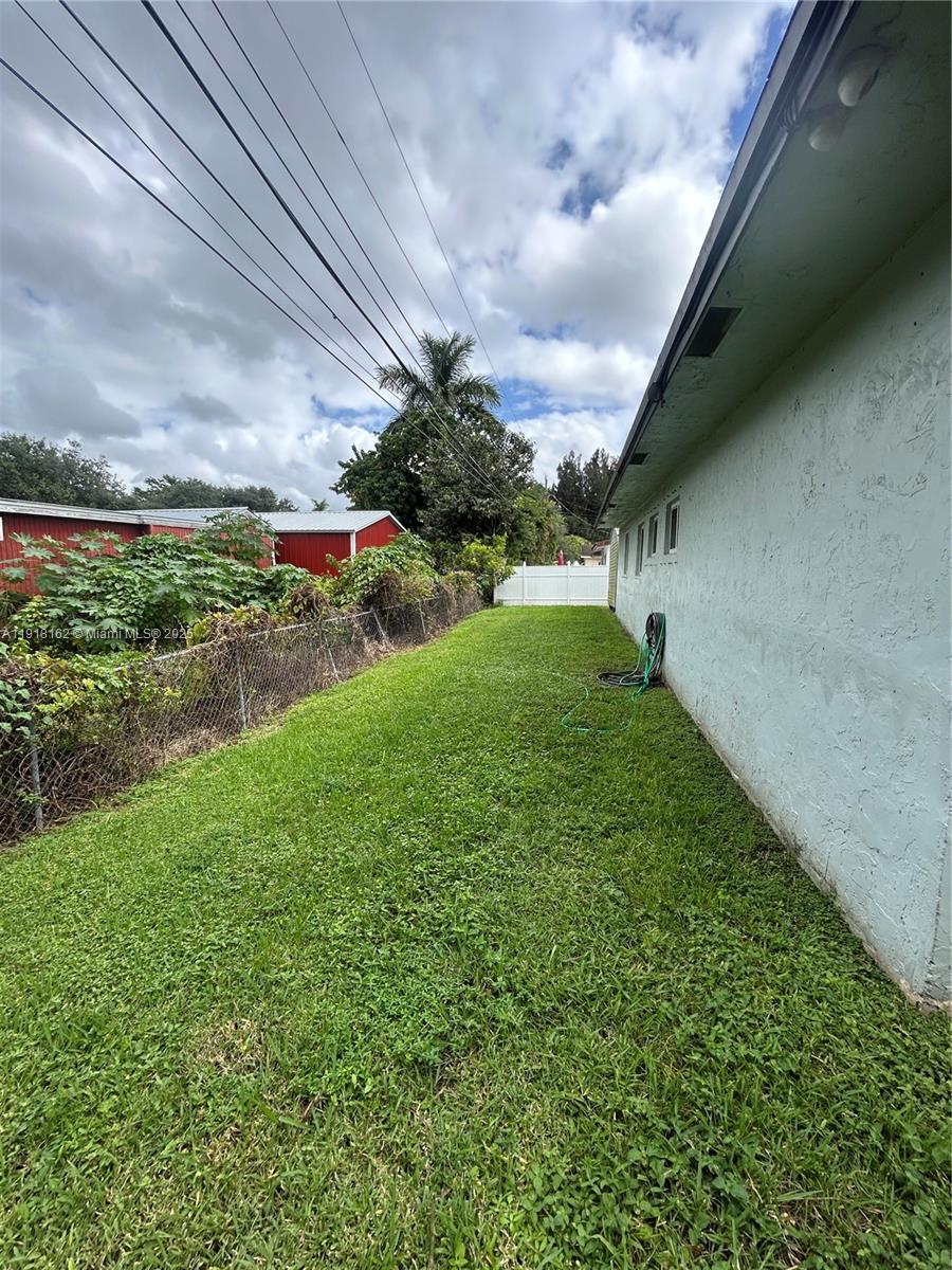 6121 Southwest 48th Court, Unit 3 Davie, FL 33314 - Photo 14 of 14 a view of a yard with an outdoor seating