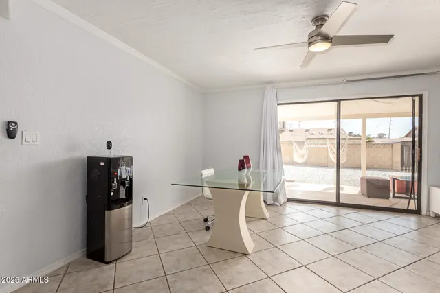a floor to ceiling window and hardwood floor