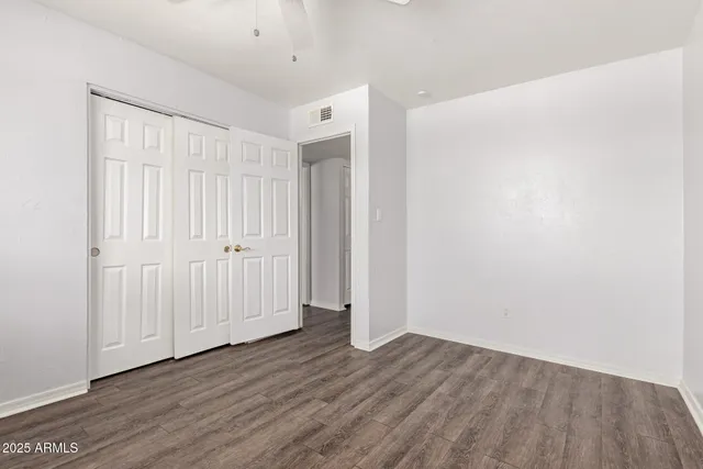 a view of a livingroom with wooden floor