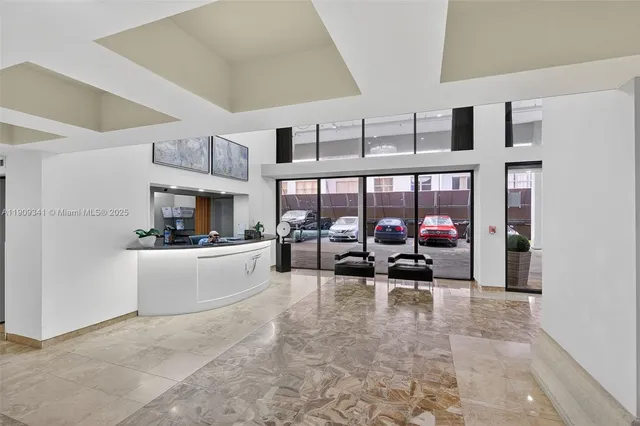 a view of an empty room and a window