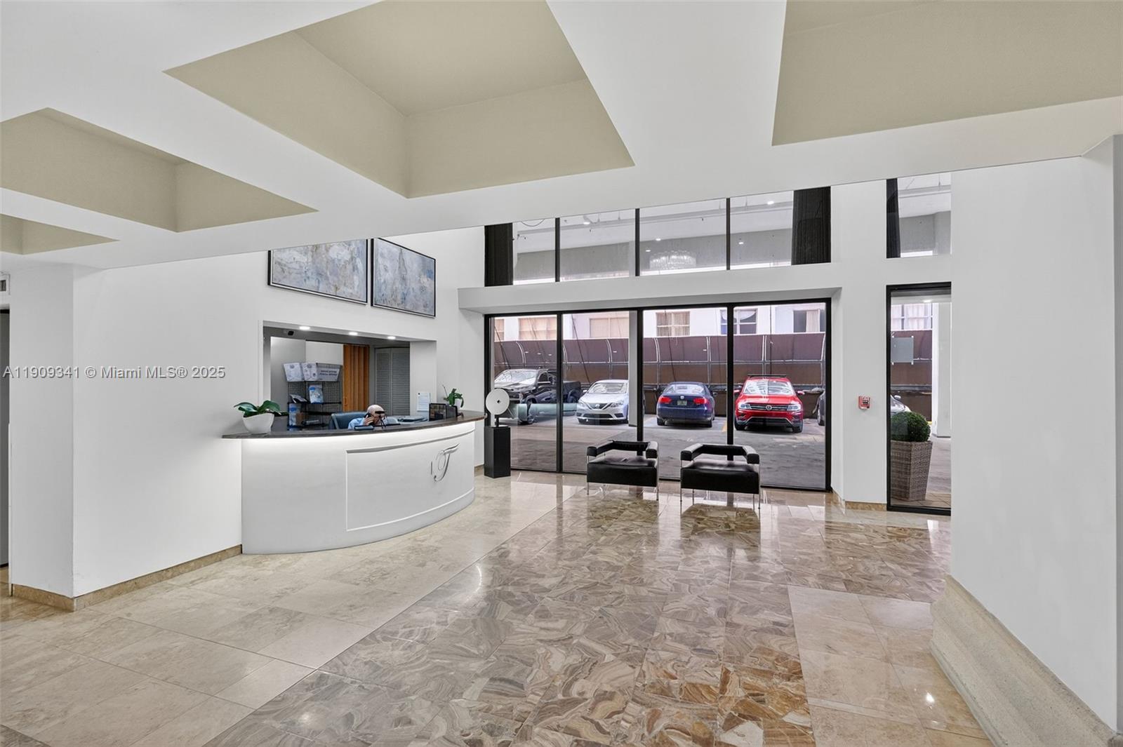 6061 Collins Avenue, Unit 7B Miami Beach, FL 33140 - Photo 11 of 41 a living room with furniture and a large window