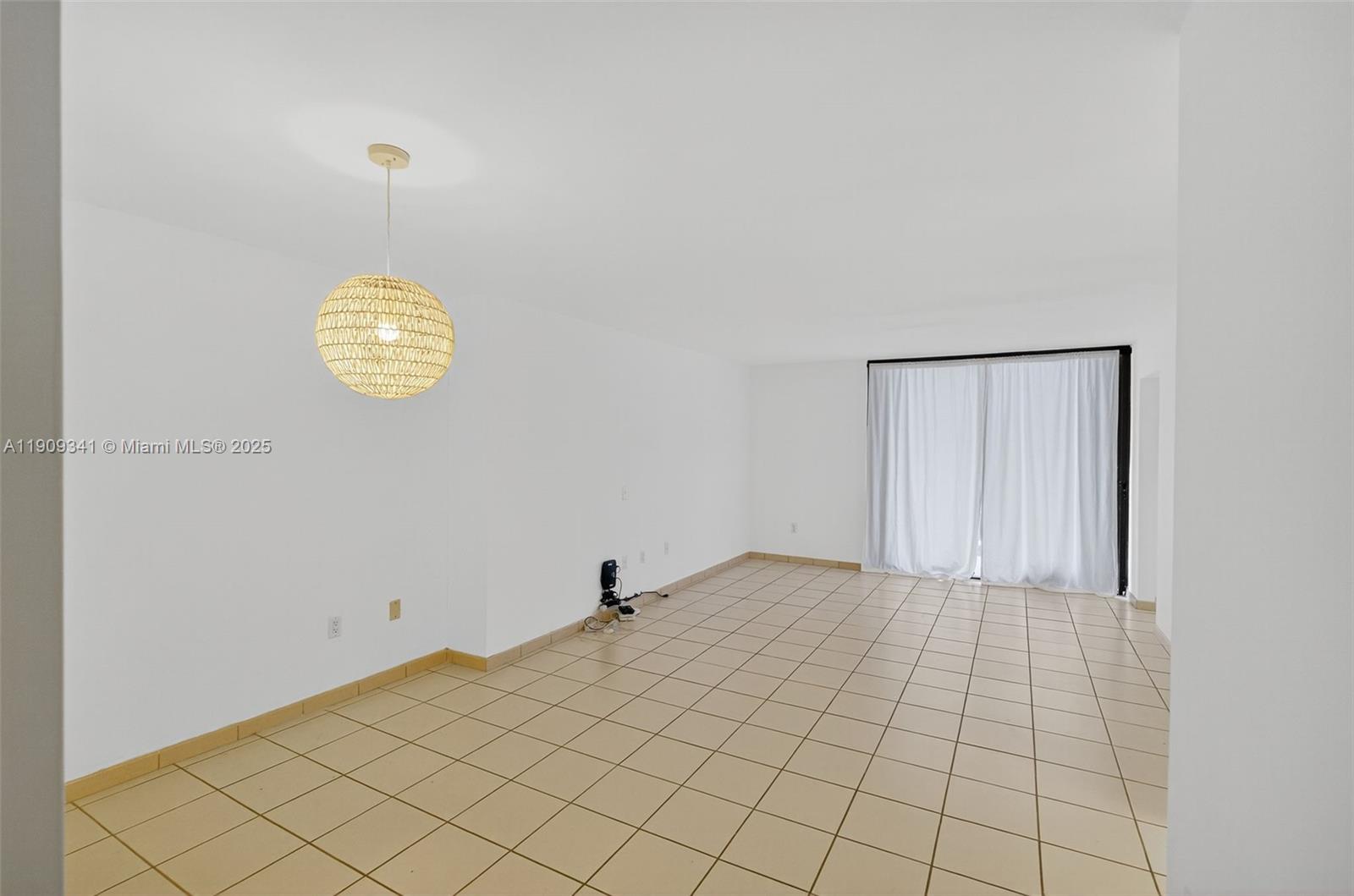 6061 Collins Avenue, Unit 7B Miami Beach, FL 33140 - Photo 14 of 41 a view of an empty room and a window