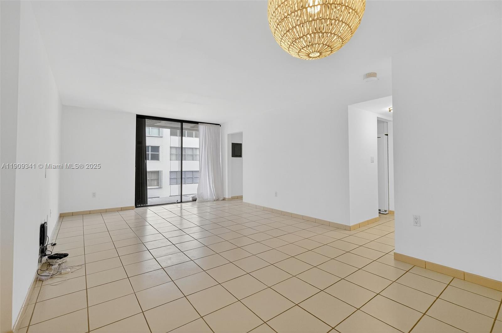 6061 Collins Avenue, Unit 7B Miami Beach, FL 33140 - Photo 17 of 41 an empty room with windows