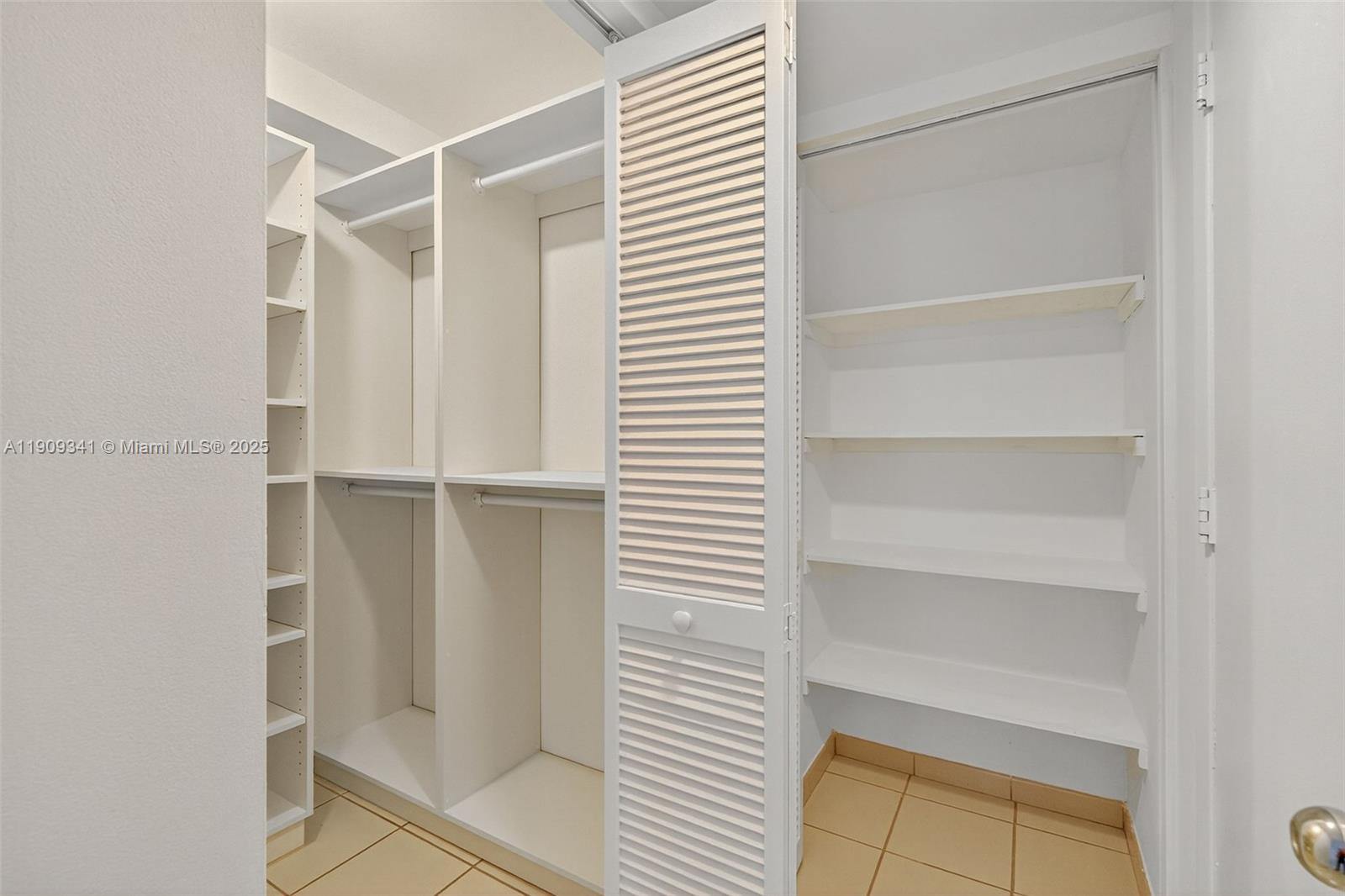 6061 Collins Avenue, Unit 7B Miami Beach, FL 33140 - Photo 25 of 41 a view of walk in closet