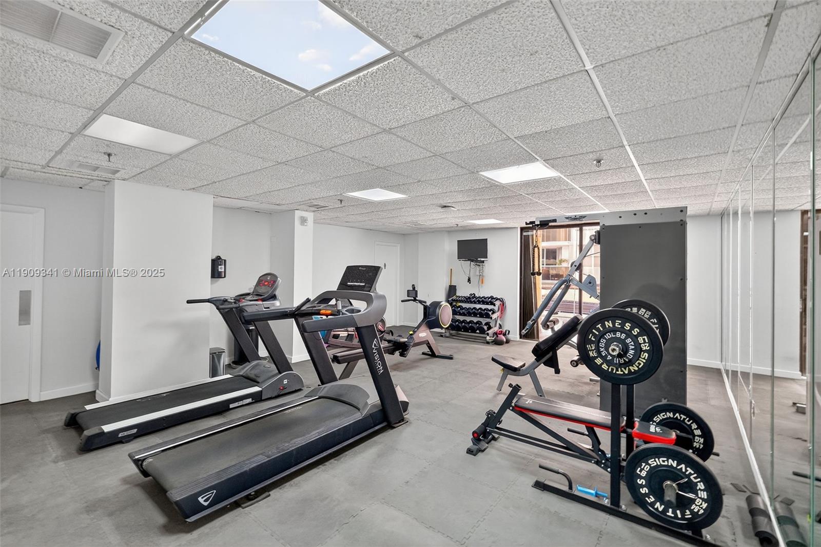 6061 Collins Avenue, Unit 7B Miami Beach, FL 33140 - Photo 29 of 41 a view of a room with gym equipment