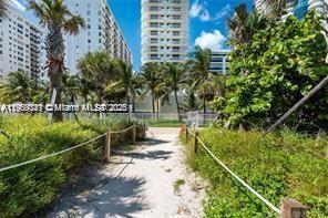 6061 Collins Avenue, Unit 7B Miami Beach, FL 33140 - Photo 3 of 41 a view of a yard
