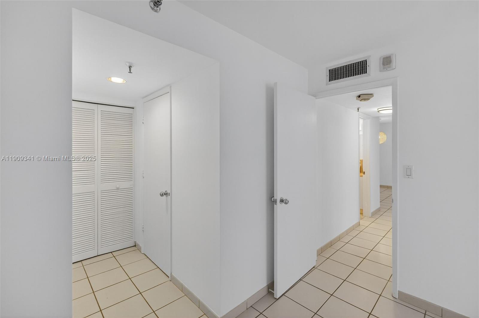 6061 Collins Avenue, Unit 7B Miami Beach, FL 33140 - Photo 31 of 41 a view of a hallway