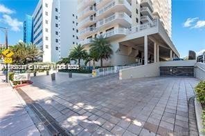 6061 Collins Avenue, Unit 7B Miami Beach, FL 33140 - Photo 34 of 41 a view of a building with sitting area