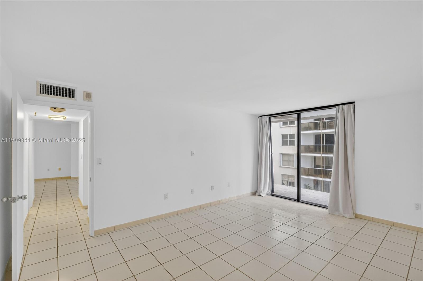 6061 Collins Avenue, Unit 7B Miami Beach, FL 33140 - Photo 36 of 41 an empty room with closet