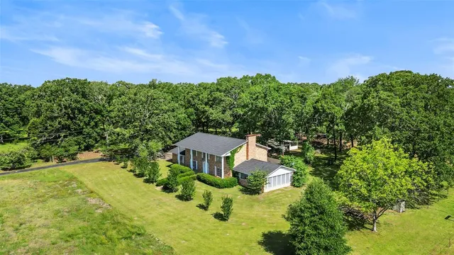 a aerial view of a house with garden