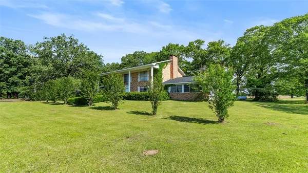 a house view with a garden space