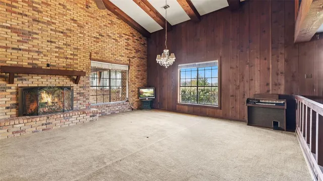 a view of a livingroom with furniture and chandelier