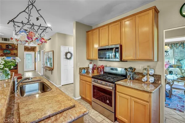 a view of a room with wooden floor and windows