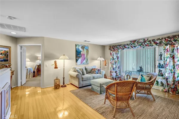 a kitchen with stainless steel appliances granite countertop wooden cabinets a sink and a window