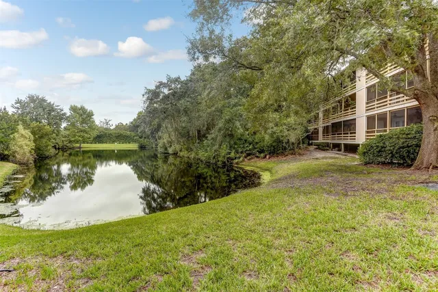 a view of a lake with a house in the background