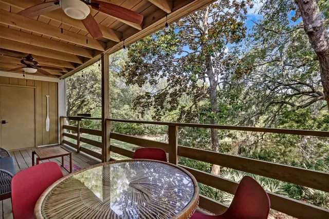 a view of balcony with furniture